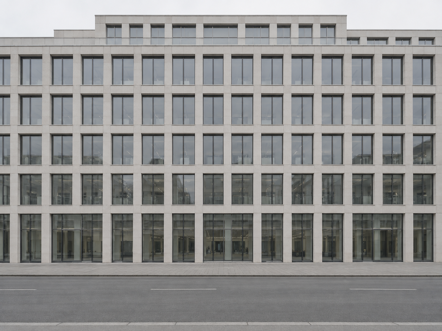 A large commercial office building photographed straight on in flat daylight
